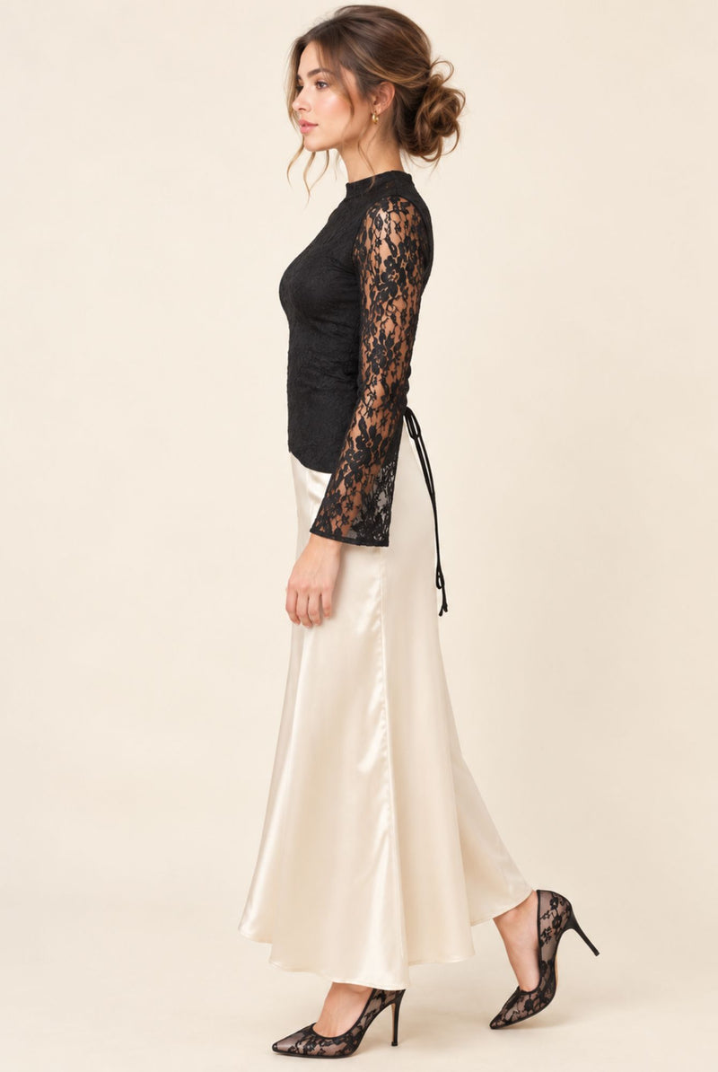 Side view of petite lace and satin dress showing the long cream skirt and flared lace sleeve