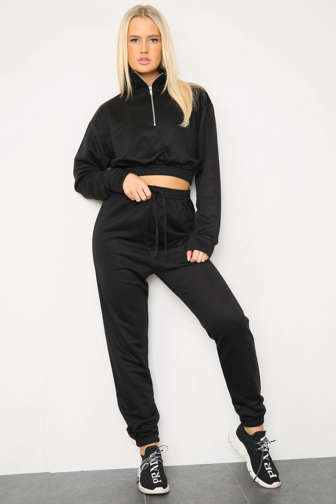 Front view of long sleeve zipper crop top with oversized matching joggers