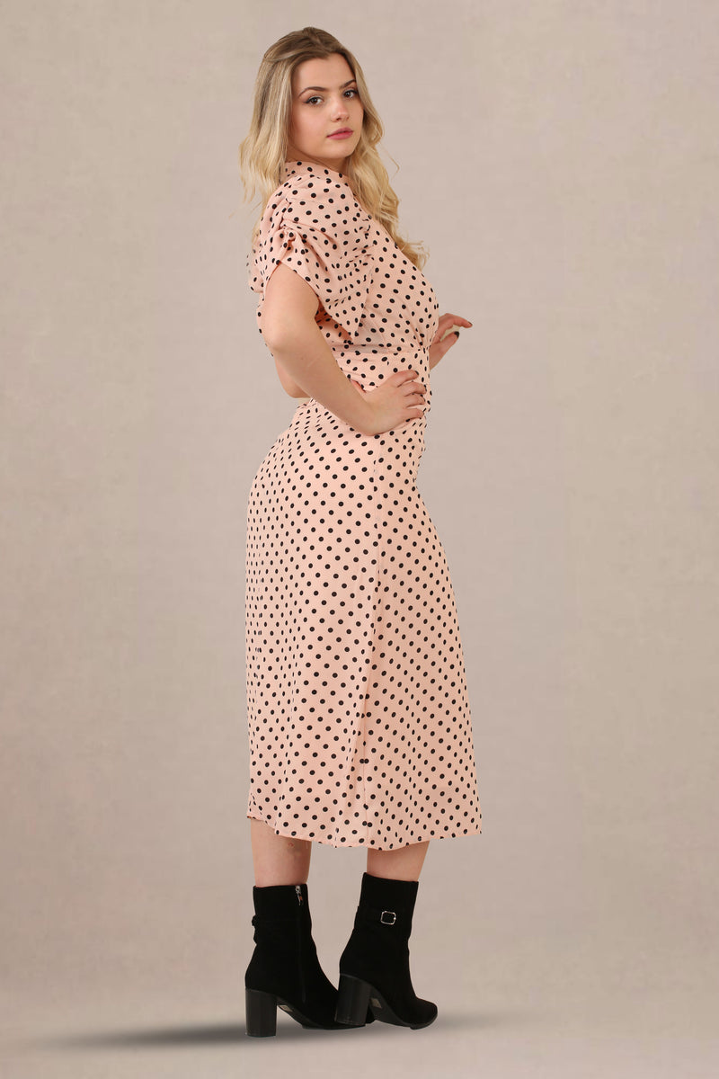 Side look of vintage-inspired puff sleeves polka dot midi dress