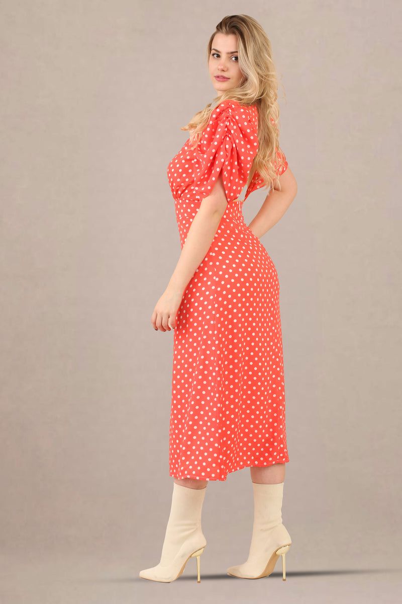 Side view of vintage-inspired puff sleeves polka dot midi dress
