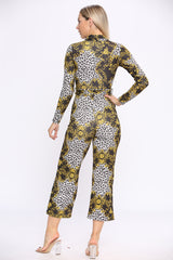 Left side view of wide leg fit statement chain print long sleeve jumpsuit