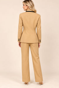 Back view of camel blazer and trouser suit set showing blazer shaping seams and cuff buttons