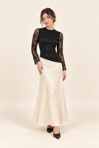 Front view of petite black and cream lace and satin maxi dress with long flared sleeves