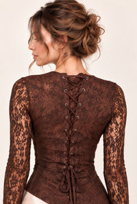 Detail of brown floral lace corset-style lace-up back and matching lace sleeves