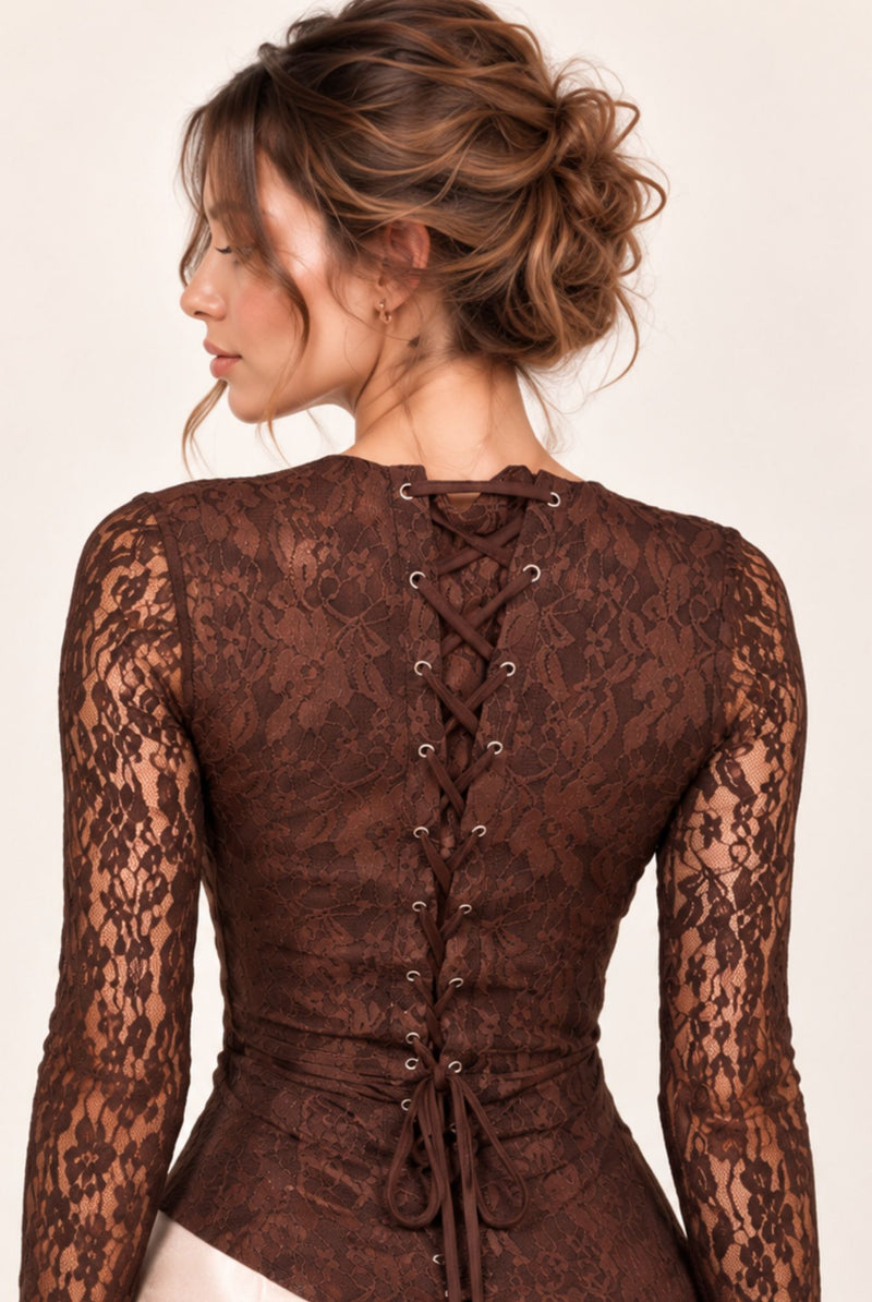 Detail of brown floral lace corset-style lace-up back and matching lace sleeves