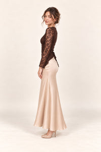 Side view of brown lace and champagne satin maxi dress with long lace sleeves