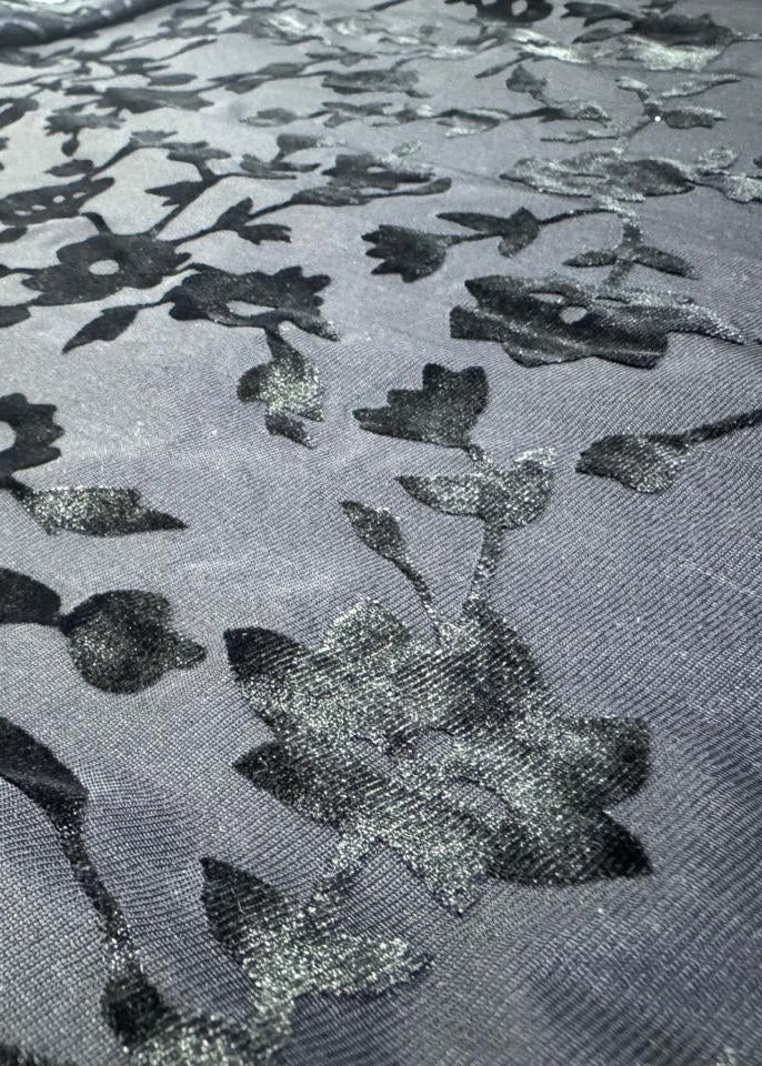 Detailed view of floral velvet burnout fabric texture on bodycon maxi dress