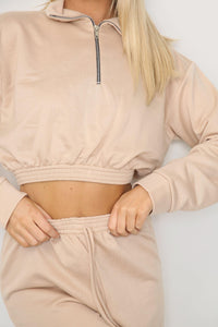 fabric of zipper detail on long sleeve crop top with oversized matching joggers