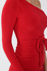 Closeup of ruched detailing on one shoulder bodycon midi dress