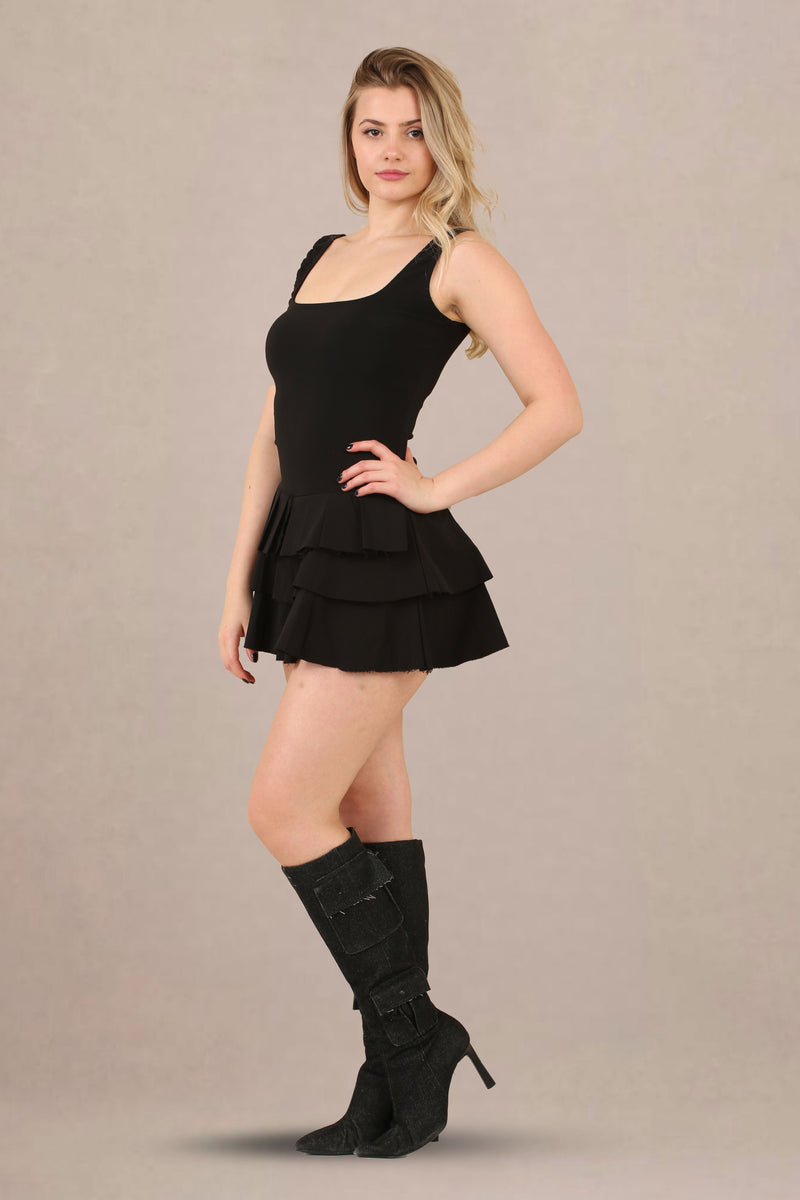 Close-up of ruffled skirt pleated stretch woven fabric skater playsuit