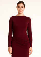 Close-up of side ruching texture and jersey fabric on bodycon evening gown in marron