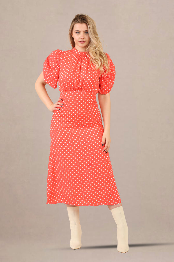 Front view of vintage-inspired puff sleeves polka dot midi dress