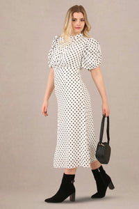 Side look of vintage-inspired puff sleeves polka dot midi dress