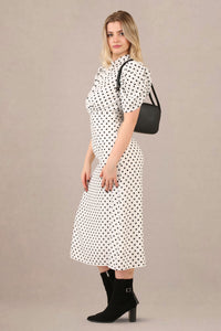 Side view of vintage-inspired puff sleeves polka dot midi dress